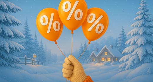 Orangefarbene Luftballons mit weißen Prozentzeichen vor einer Winterlandschaft